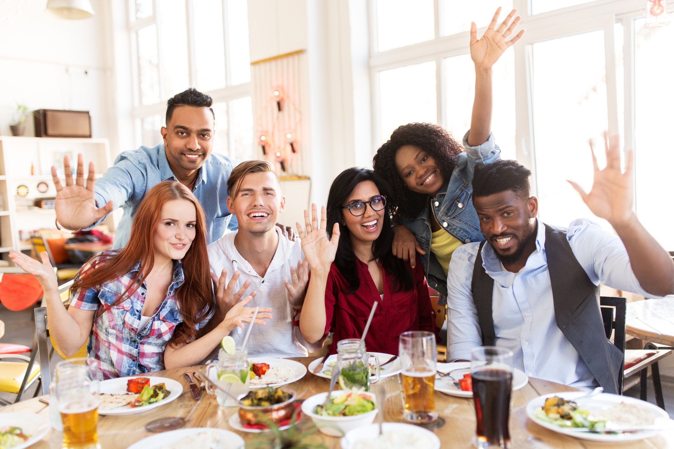 Happy Friends Eating at Restaurant